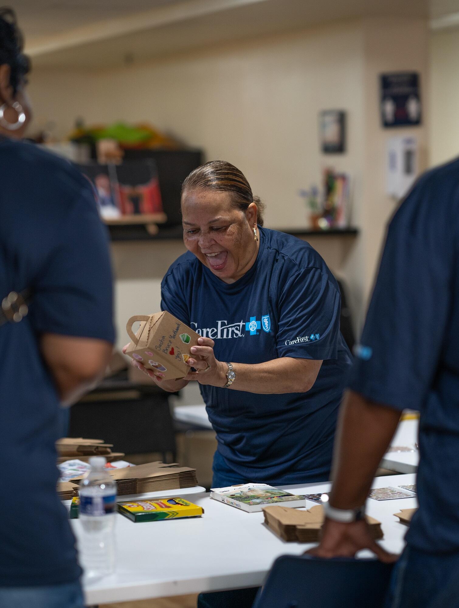 Employees packaging school supplies