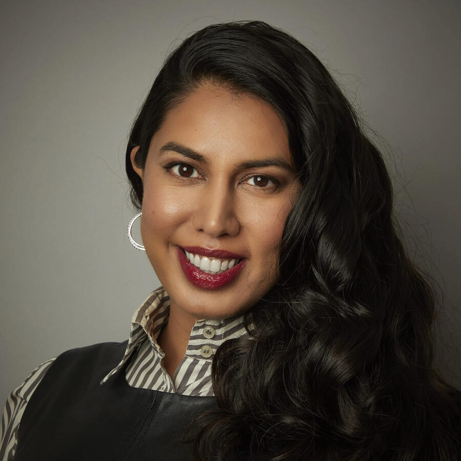 Nabiha Syed headshot on a dark gray background