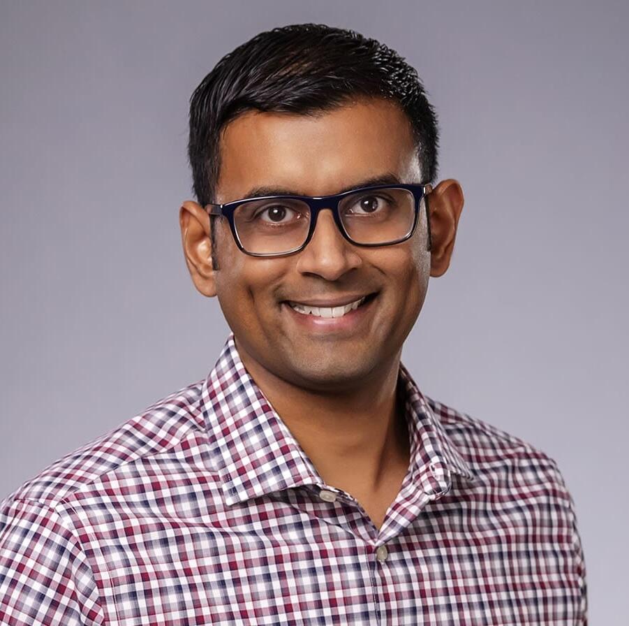 Dr. Arvind Narayanan headshot on a gray background