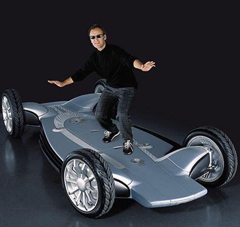 Man in black shirt and sunglasses surfing on an electric vehicle