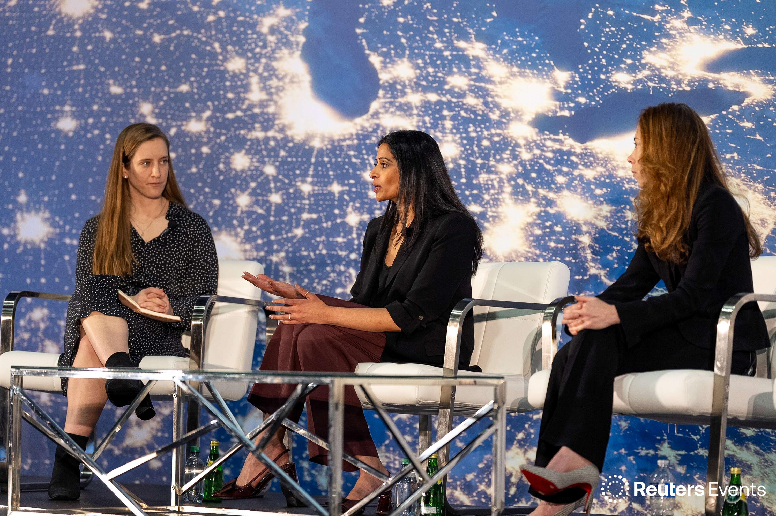 3 panellists onstage at a Reuters Pharma Event