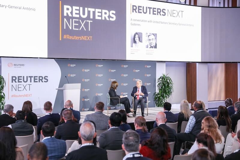 Stage interview with two speakers and audience at the Reuters NEXT conference.