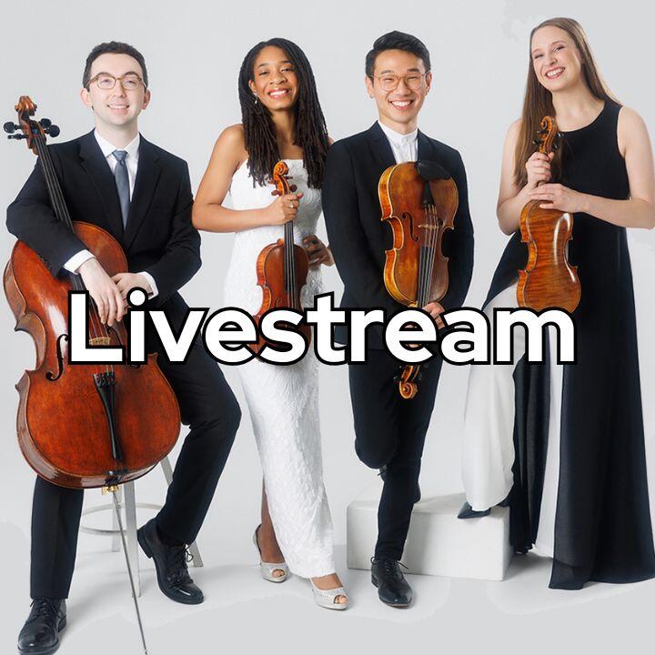 Photo of the smiling members of the Abeo Quartet dressed formally, holding instruments. Left to right: white man, black woman, Asian man, white woman.