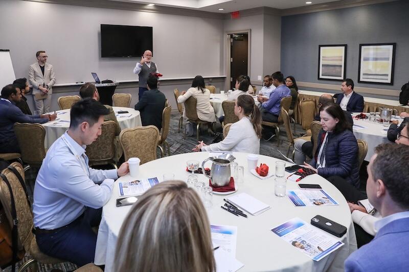 Professionals networking and discussing at Pharma Customer Engagement USA conference