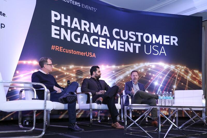 Three speakers on stage at Pharma Customer Engagement USA