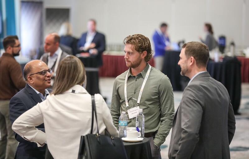 A group of Pharma leaders talking at a high table