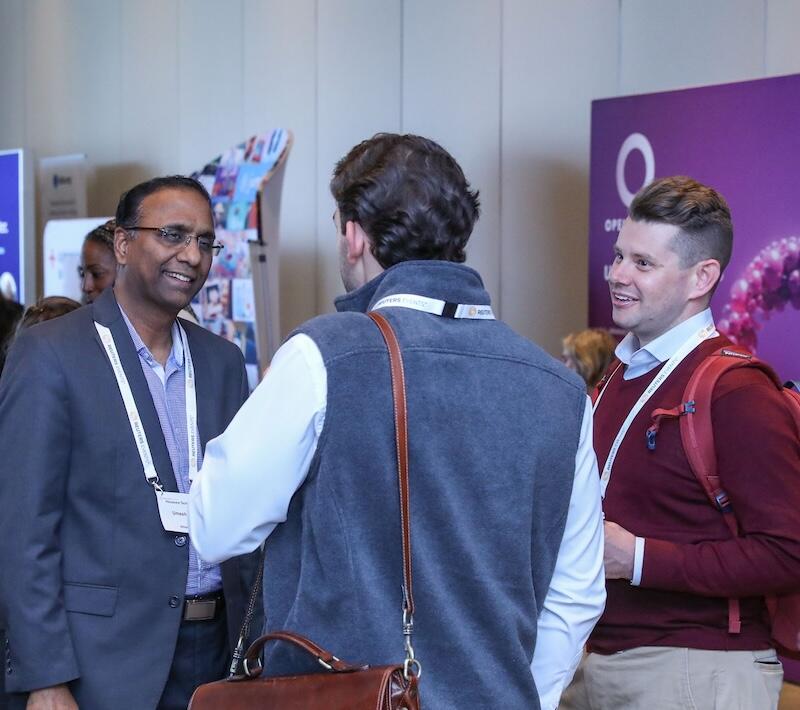 A networking discussion between three people. 