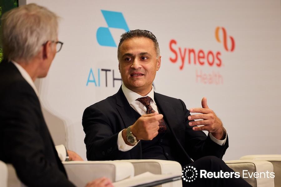 Two speakers on stage having a discussion