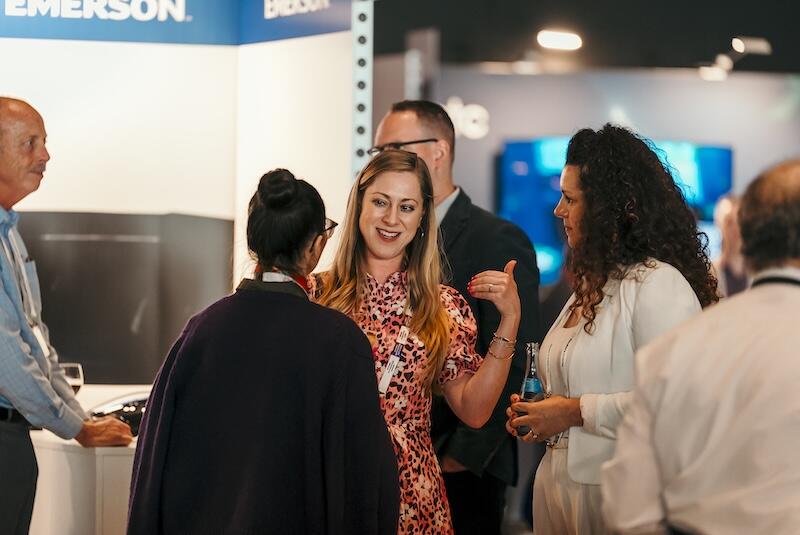 A group of people networking over drinks.