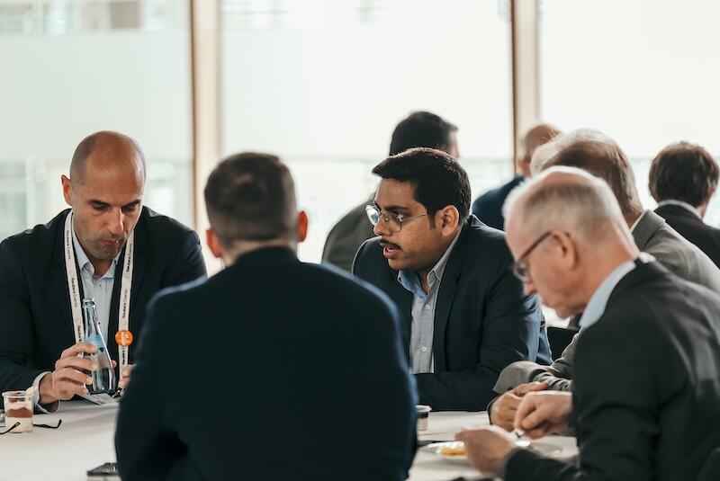 A group of people at a roundtable