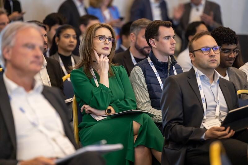 A room full of attendees at a Reuters Event conference