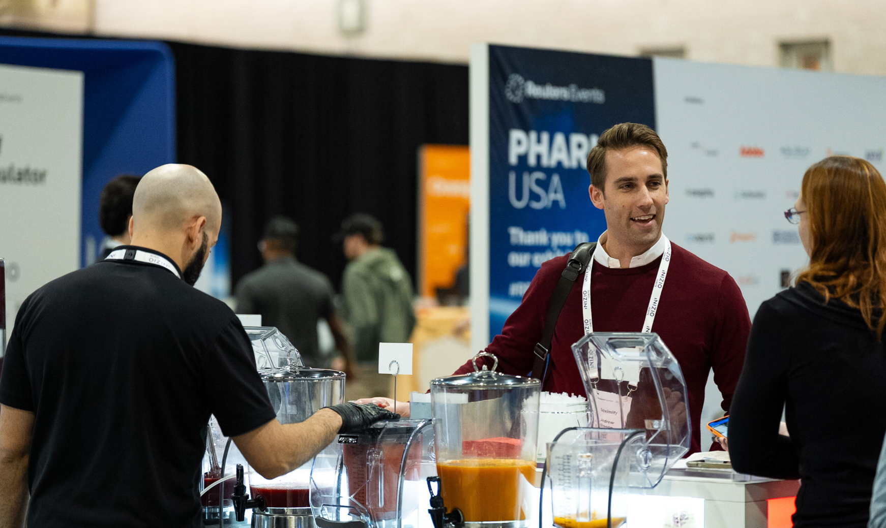 Attendee at a juice bar station on the expo floor at Pharma USA, a Reuters Events conference