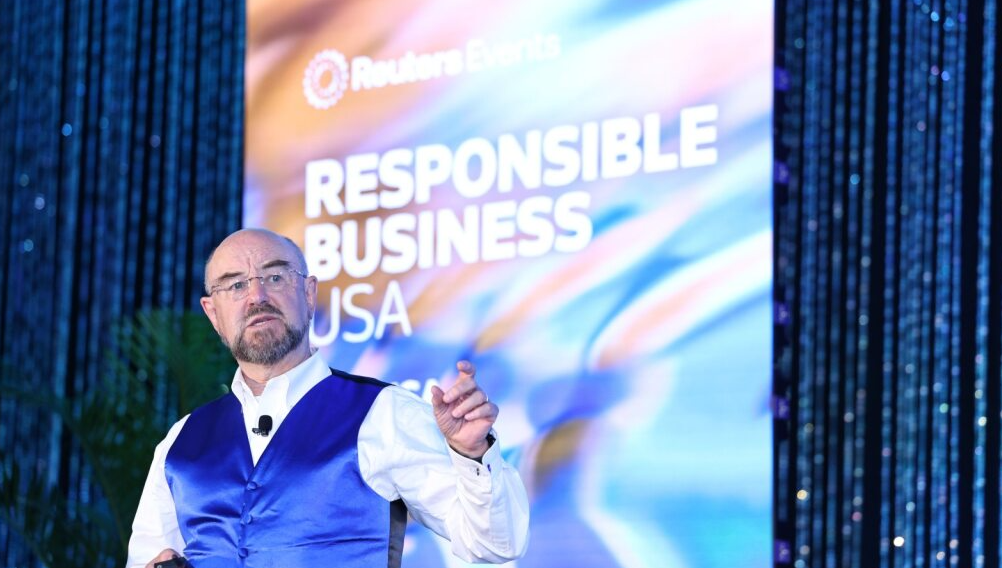 Speaker in blue vest presenting at Reuters Events' Responsible Business USA 2025 conference