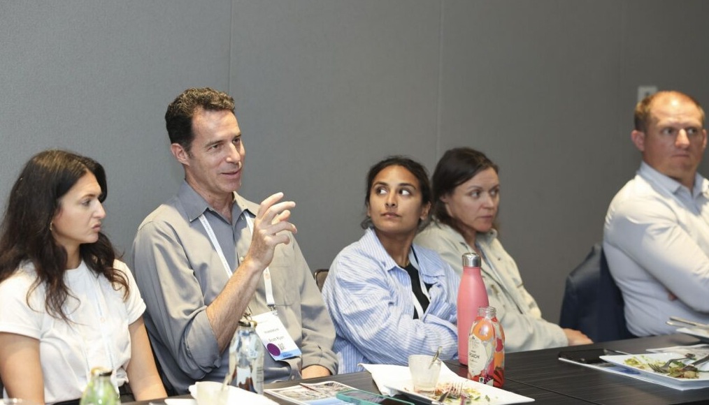 Responsible Business USA conference roundtable discussion with attendees seated at a table