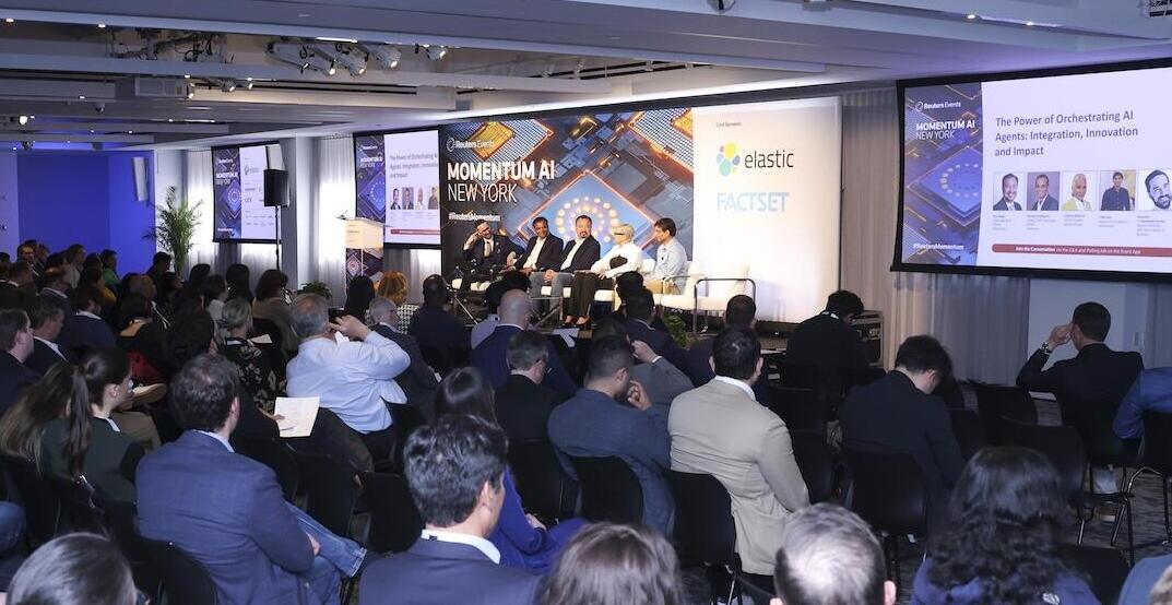 A Photo of a room full of people at a conference