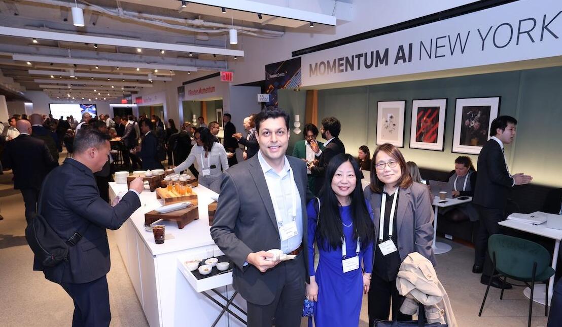 Three people posing for a photo at an event