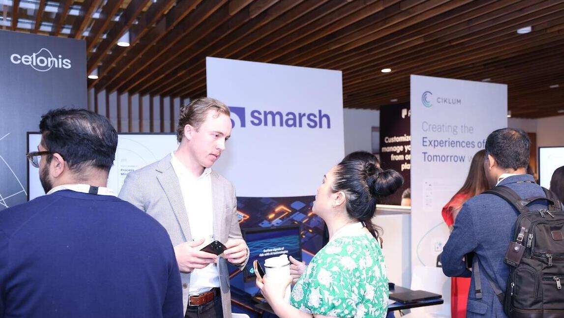 Exhibitors talking to delegates 