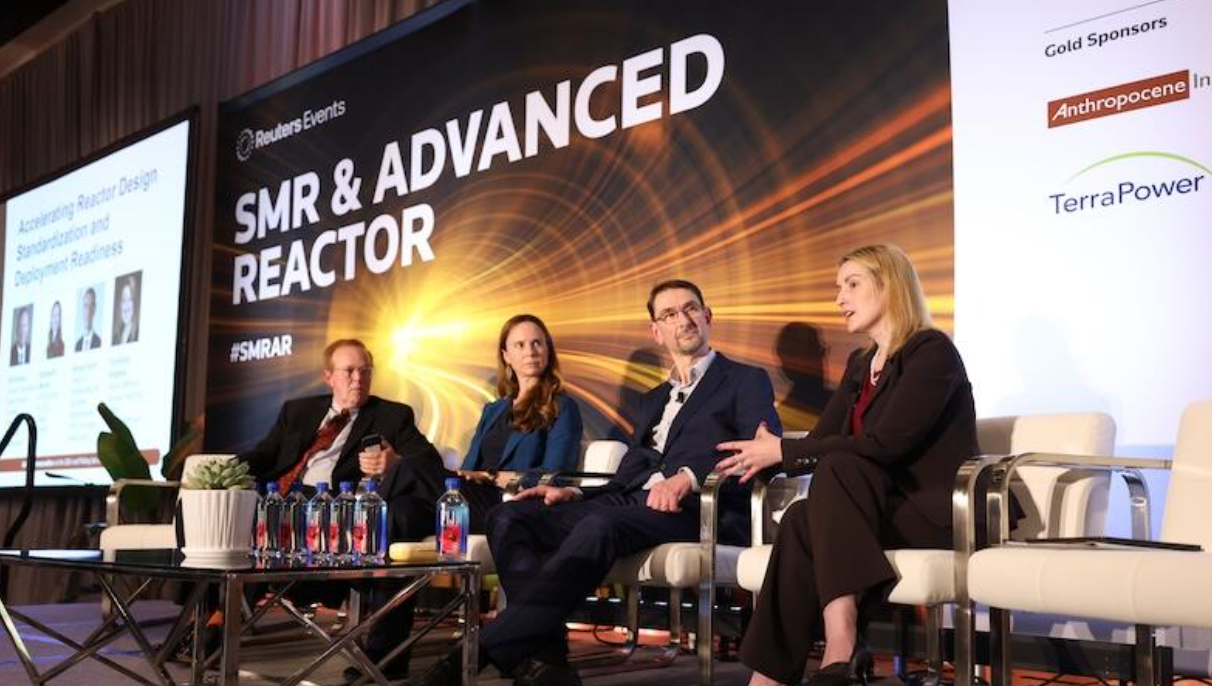 Panelists discuss reactor standardization at the SMR & Advanced Reactor conference, with stage branding and sponsor logos visible.
