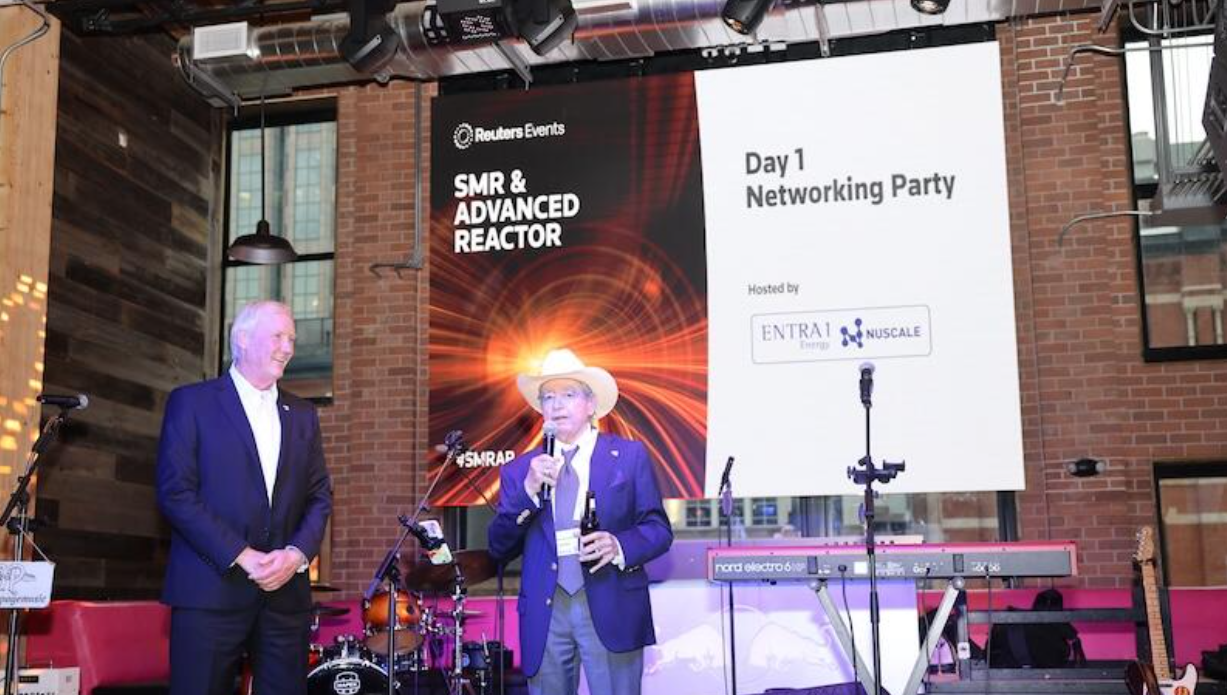 Two speakers on stage open the Day 1 SMR & Advanced Reactor networking party, with event signage and band setup visible.