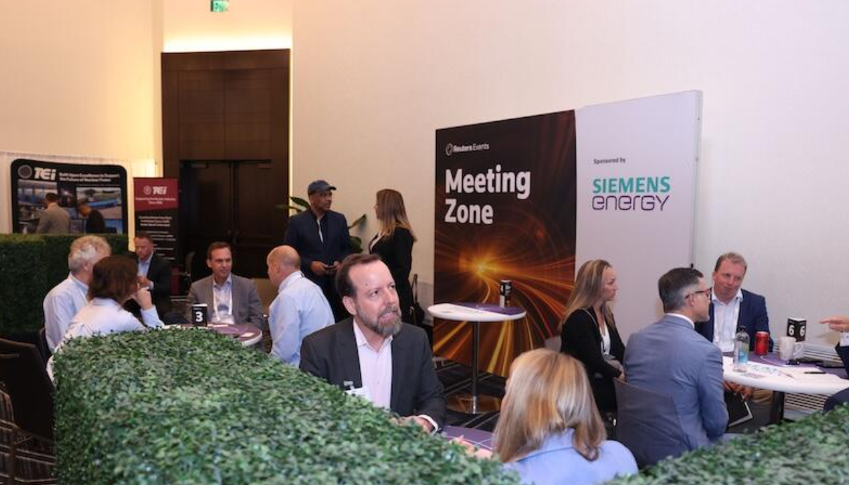 Attendees hold 1:1 meetings in the Meeting Zone, sponsored by Siemens Energy, at the SMR & Advanced Reactor conference.
