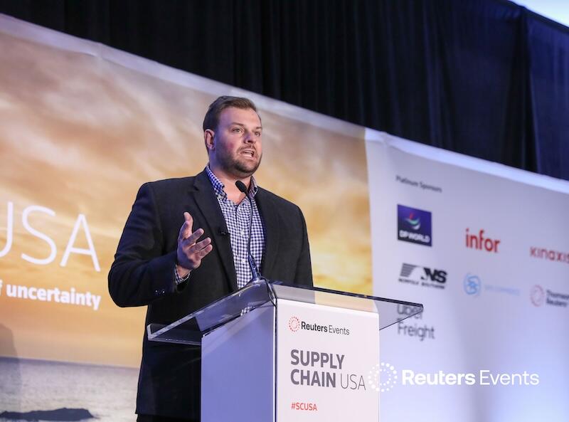 A speaker on stage talking at the Supply Chain USA show