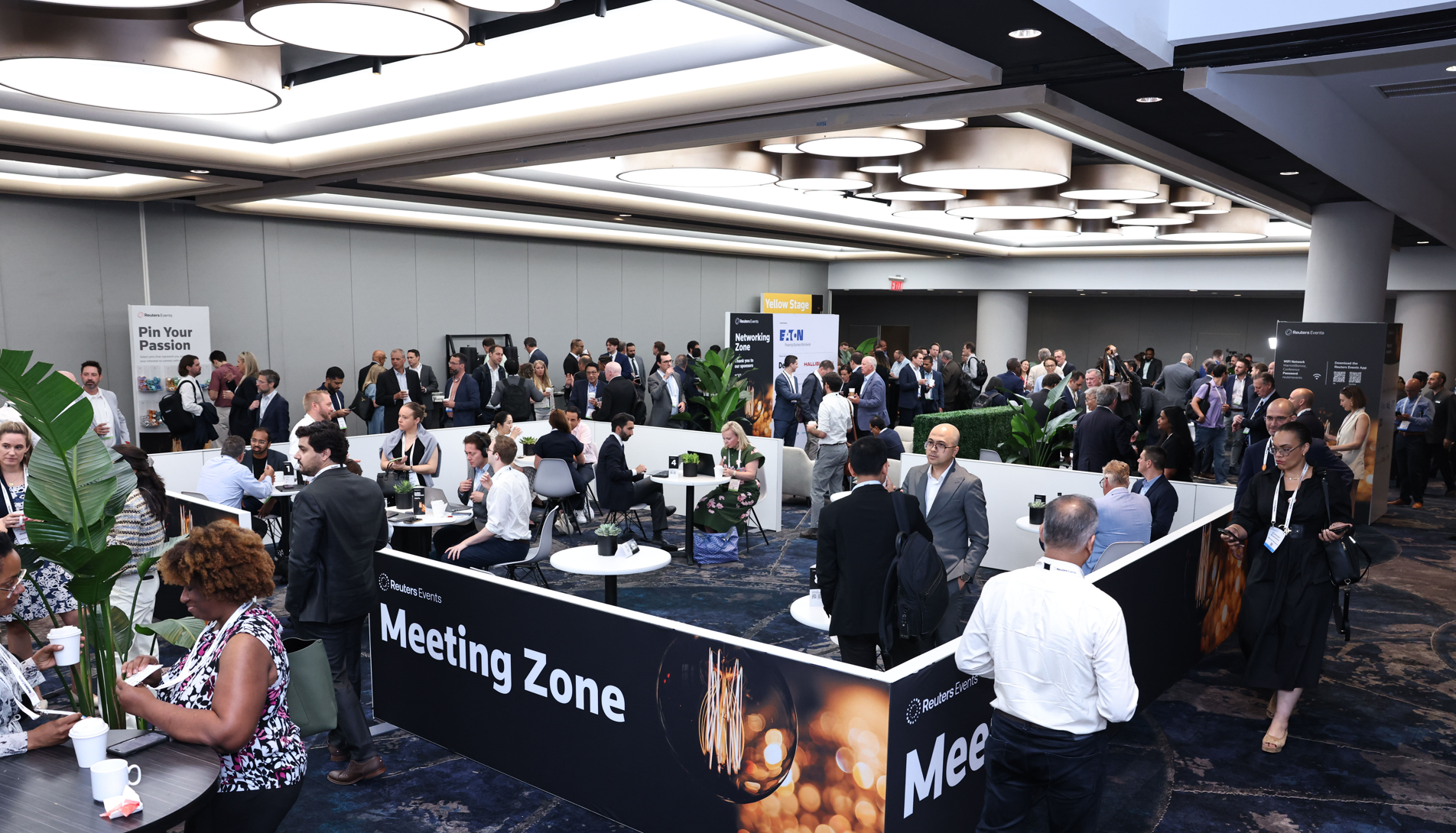Attendees network in the Reuters Events Meeting Zone.