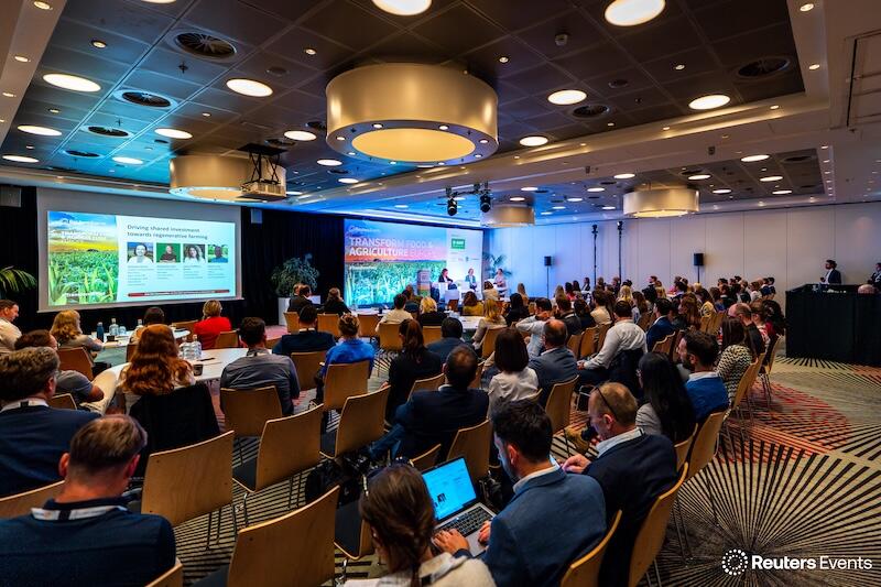 A photo of the room at a Transform Food & Agriculture event of people listening to a presentation 