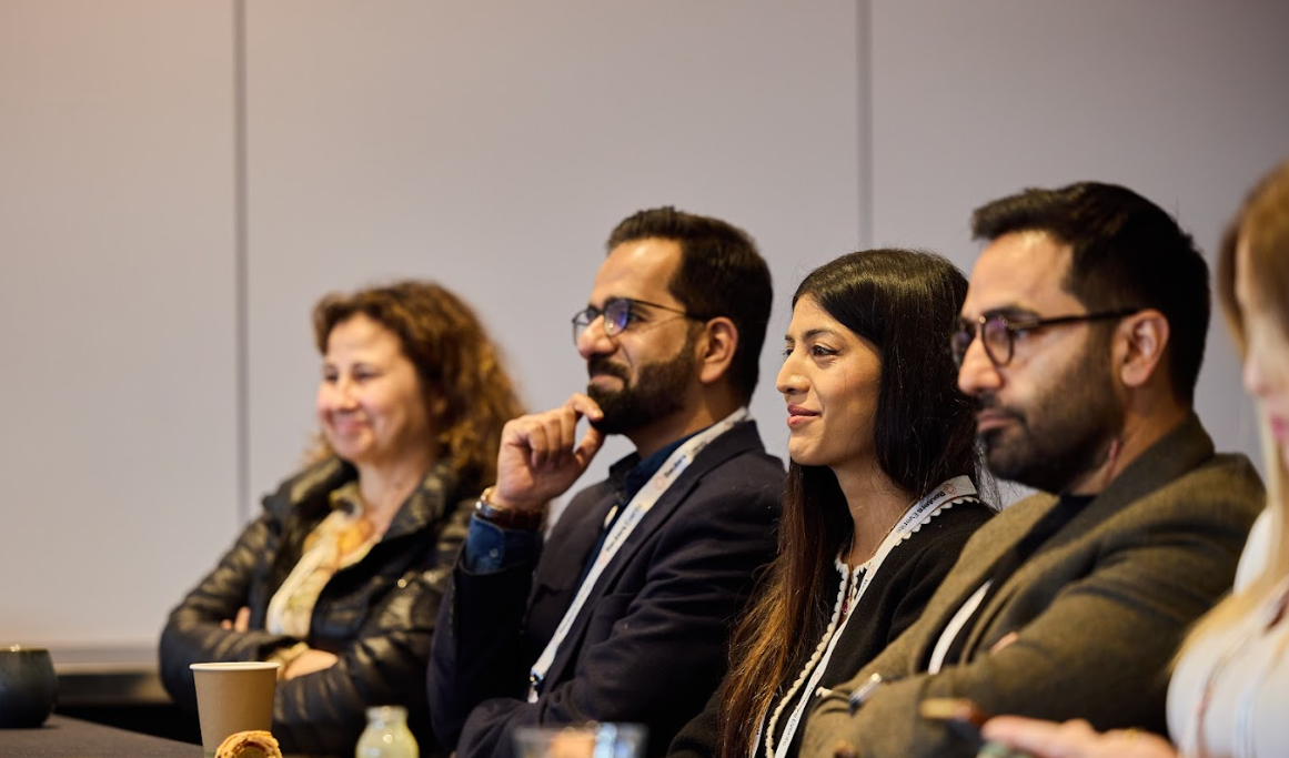 Attendees listening to a session at the Momentum AI London conference.