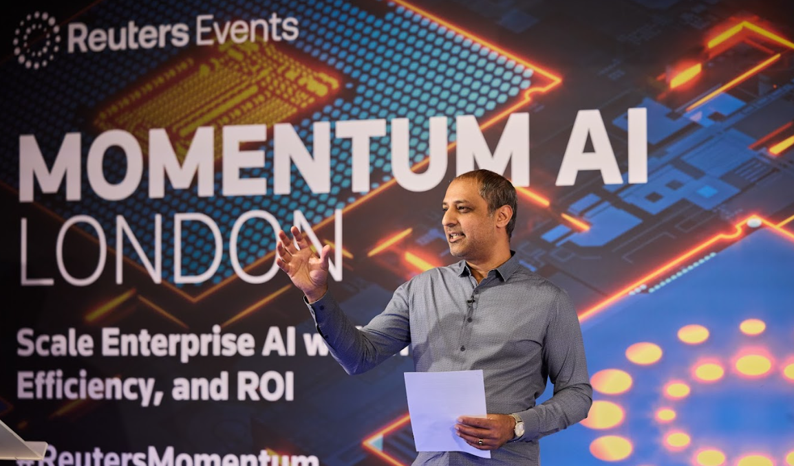 Speaker presenting on stage at the Momentum AI London conference