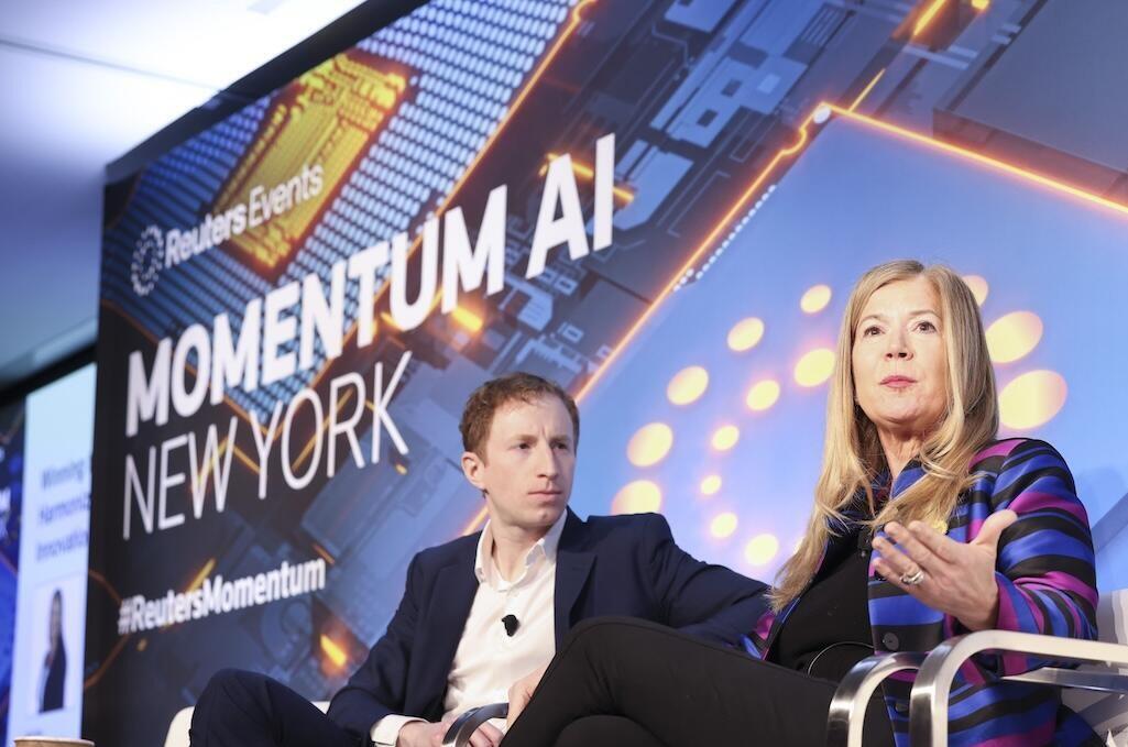 2 speakers onstage at Momentum AI New York