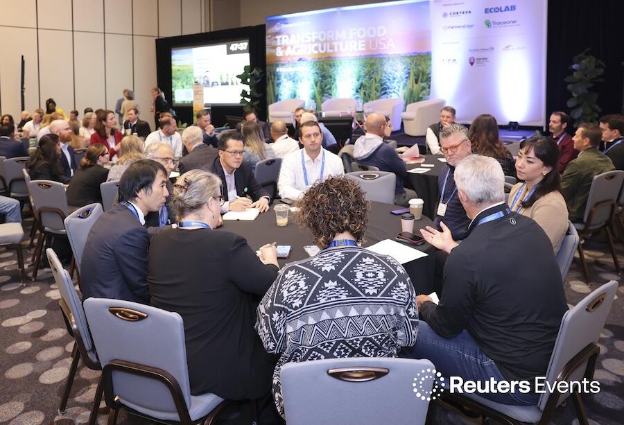 A room of people at roundtables discussing a topic  at last years Transform Food & Agriculture USA