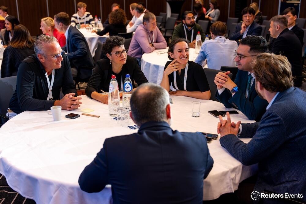 A large roundtable of people all discussing ideas at the The Future of Insurance USA event