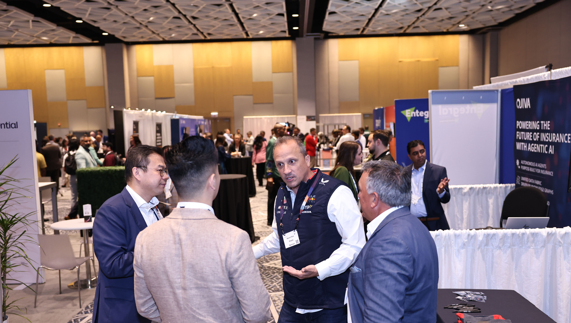 Conference attendees networking in the exhibition hall