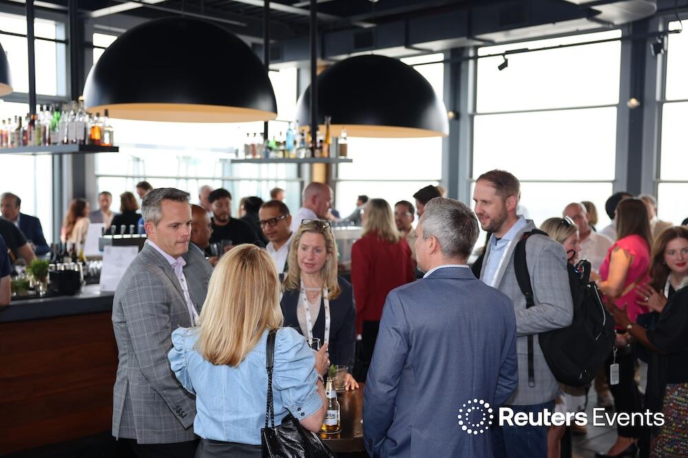 Photo of people networking at the The Future of Insurance USA event