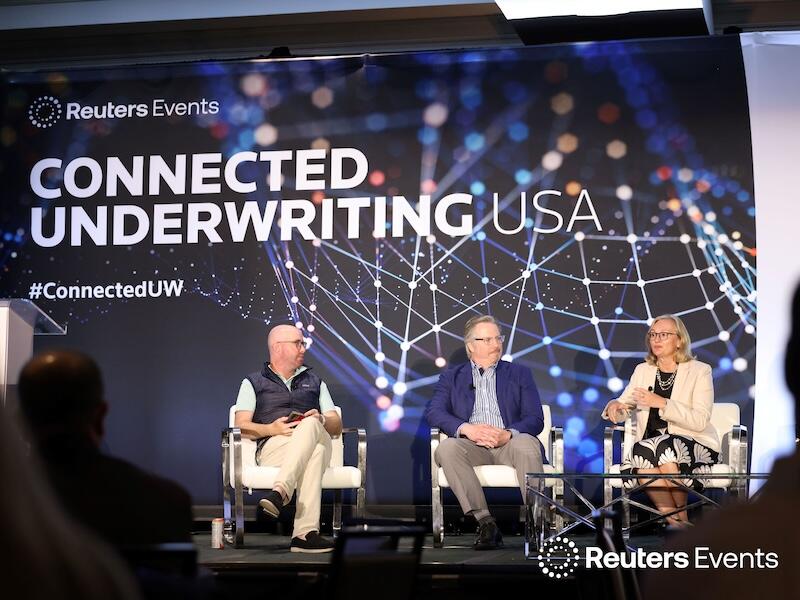Panel on stage at  Connected Underwriting USA