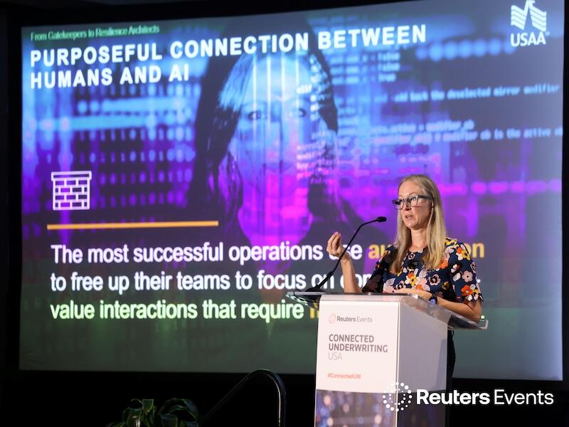 Speaker at  Connected Underwriting USA on stage giving a presentation