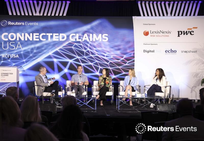 5 people on stage talking at the Connected Claims USA conference