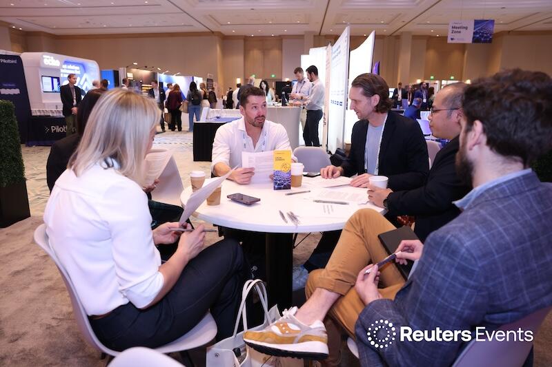 A group of people at a roundtable networking at the Connected Claims USA conference