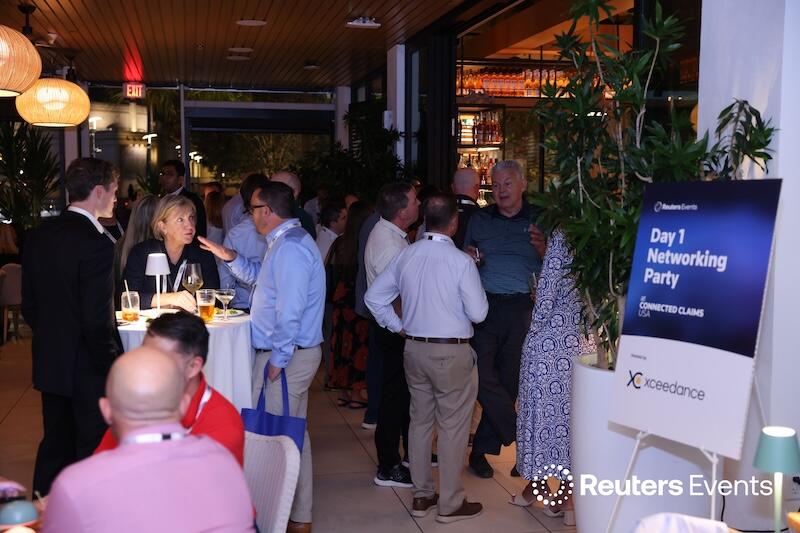 Photo of the Day 1 networking event full of people talking at the Connected Claims USA conference