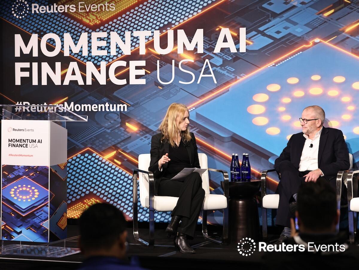 Two speakers on stage at the Momentum AI Finance USA Event