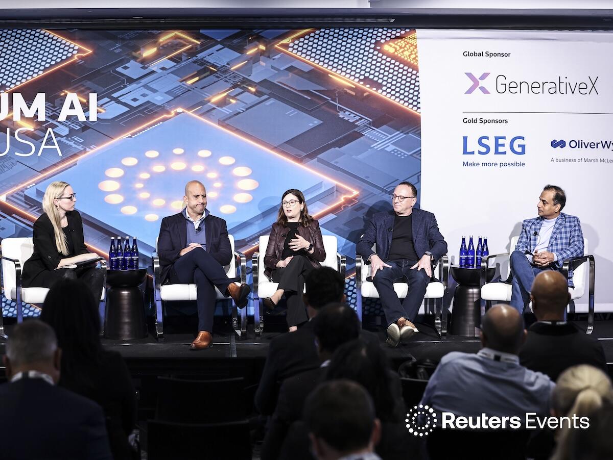 A group of presenters on stage sitting down at the Momentum AI Finance USA Event