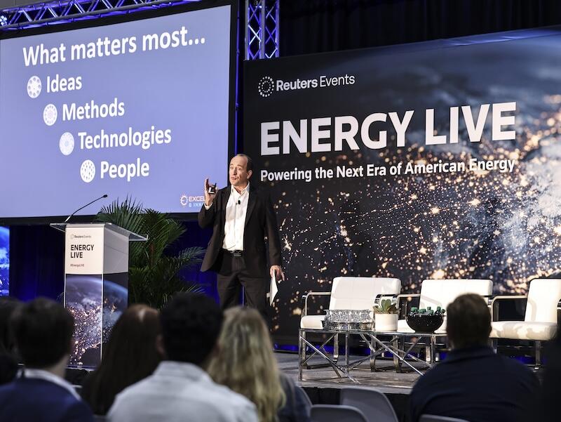 A presenter on stage at the Energy Live event. 