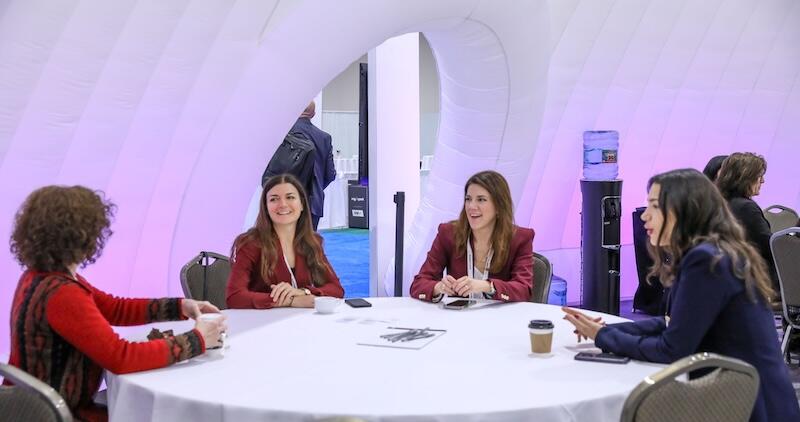 A group of people at a roundtable discussing a topic