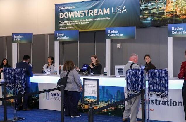 People checking into the Downstream USA 2025 event.