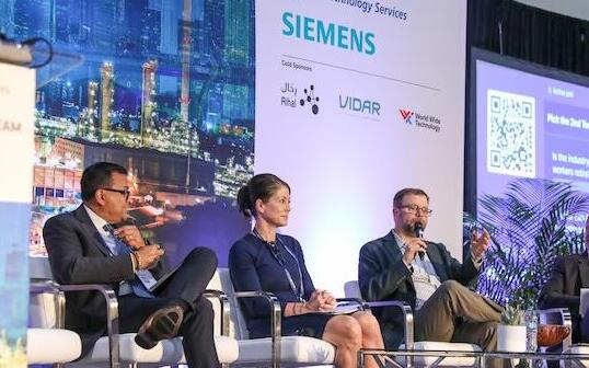 4 speakers on stage doing a panel discussion