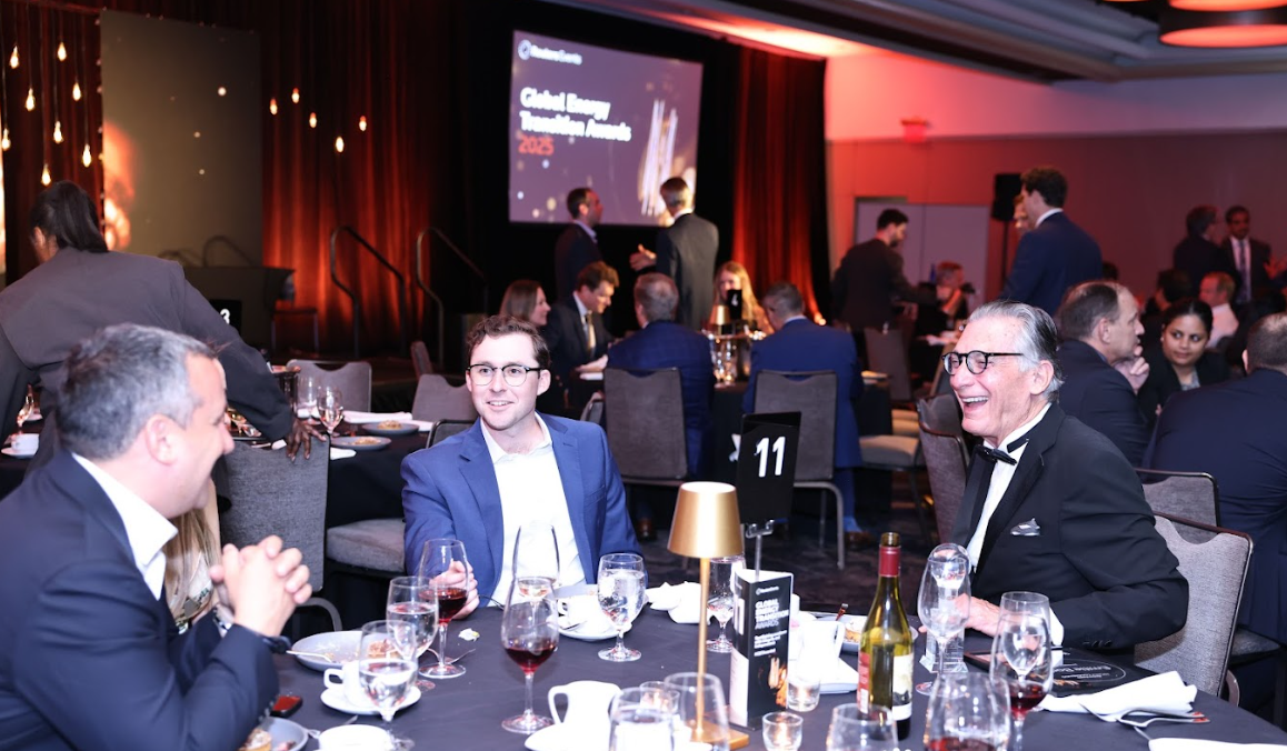 Guests seated at a dinner table talking and laughing during the Global Energy Transition Awards 2025.