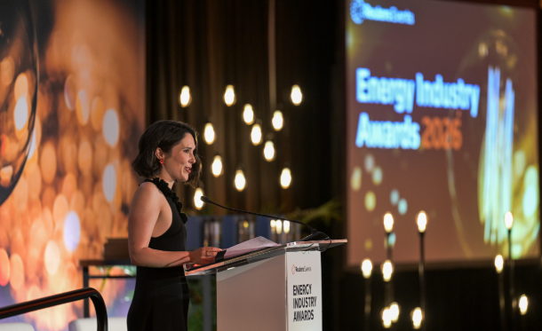 Host speaking at the podium during the Energy Industry Awards ceremony