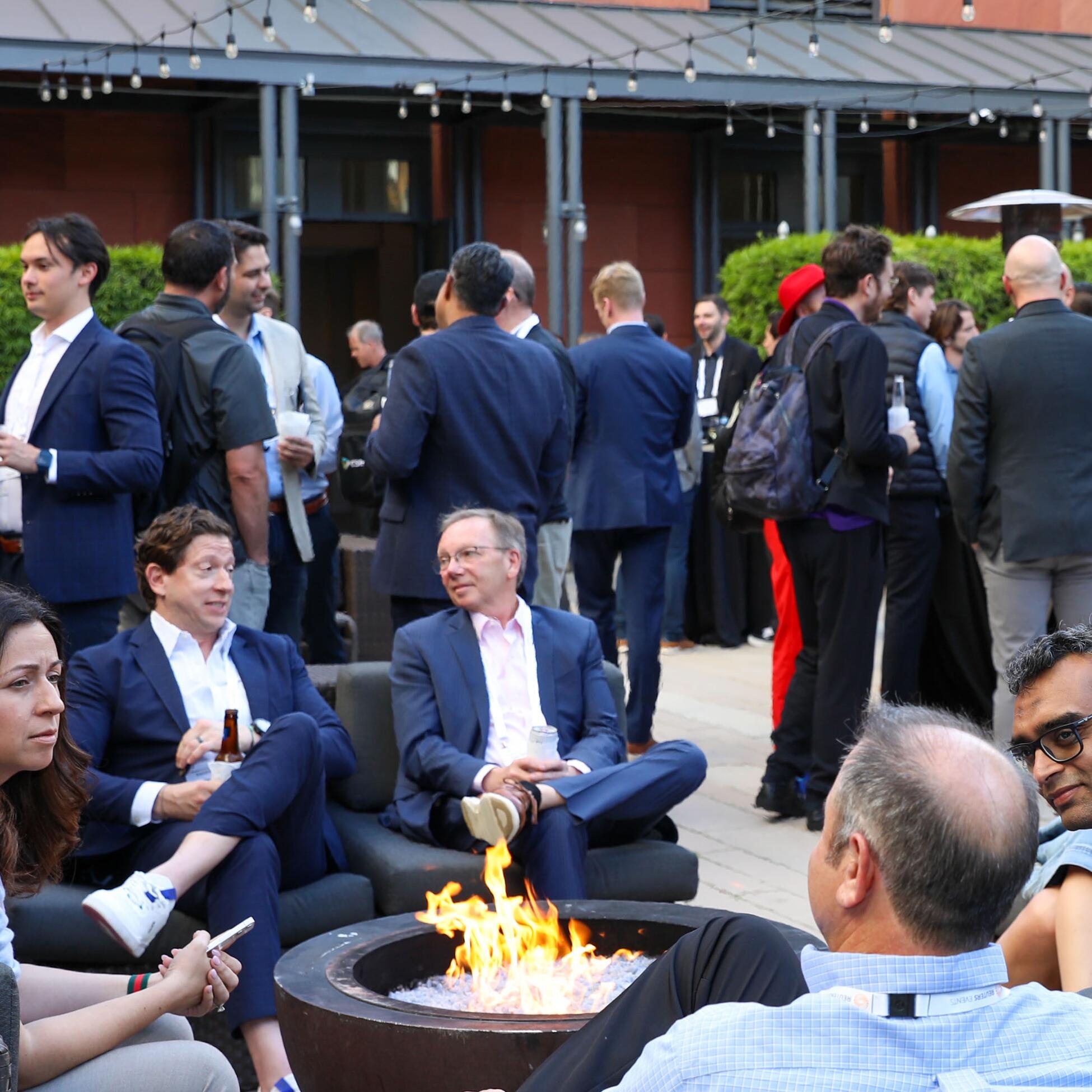 Attendees networking at an offsite party after a conference
