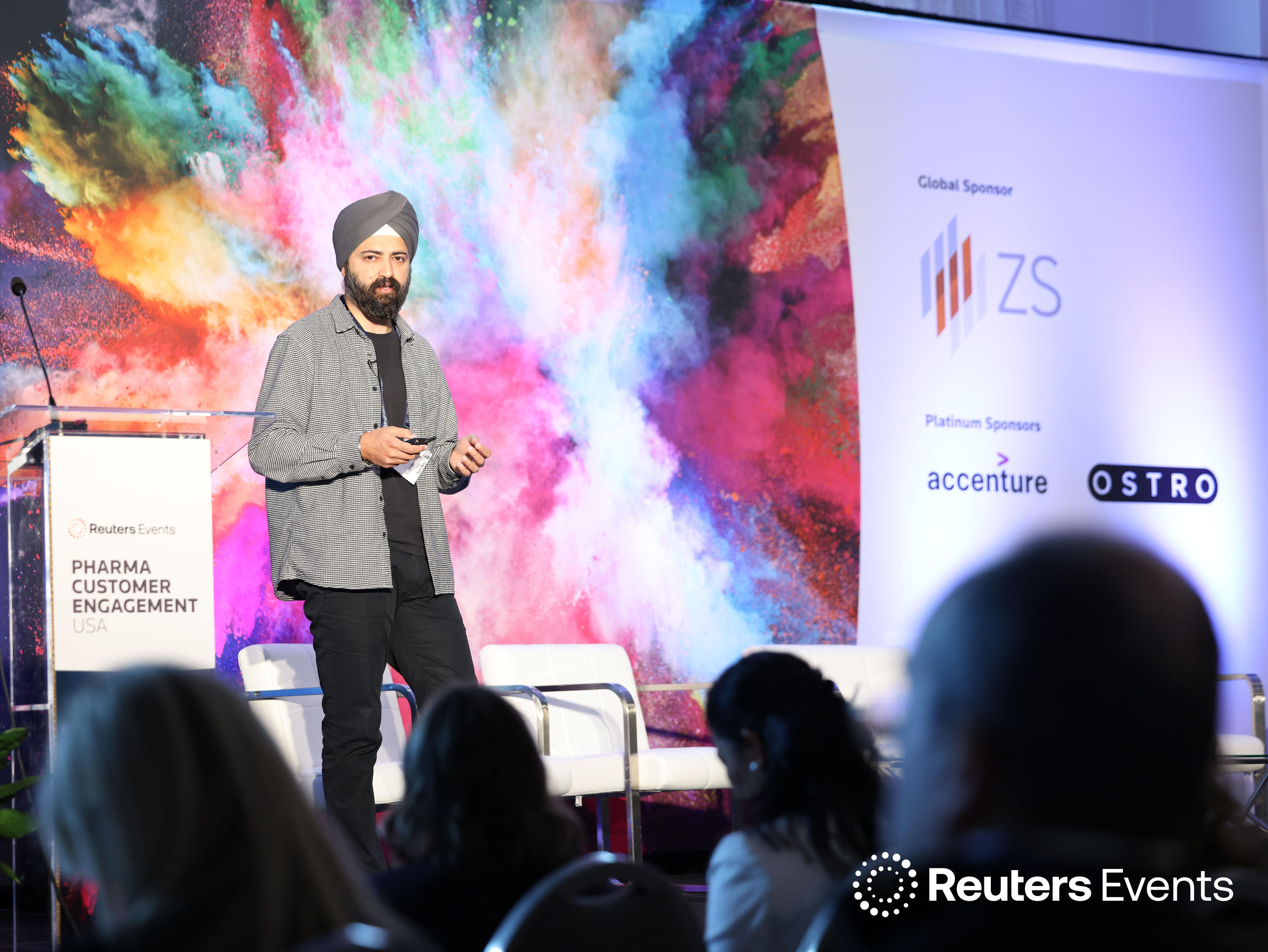 A speaker on stage at one of our events