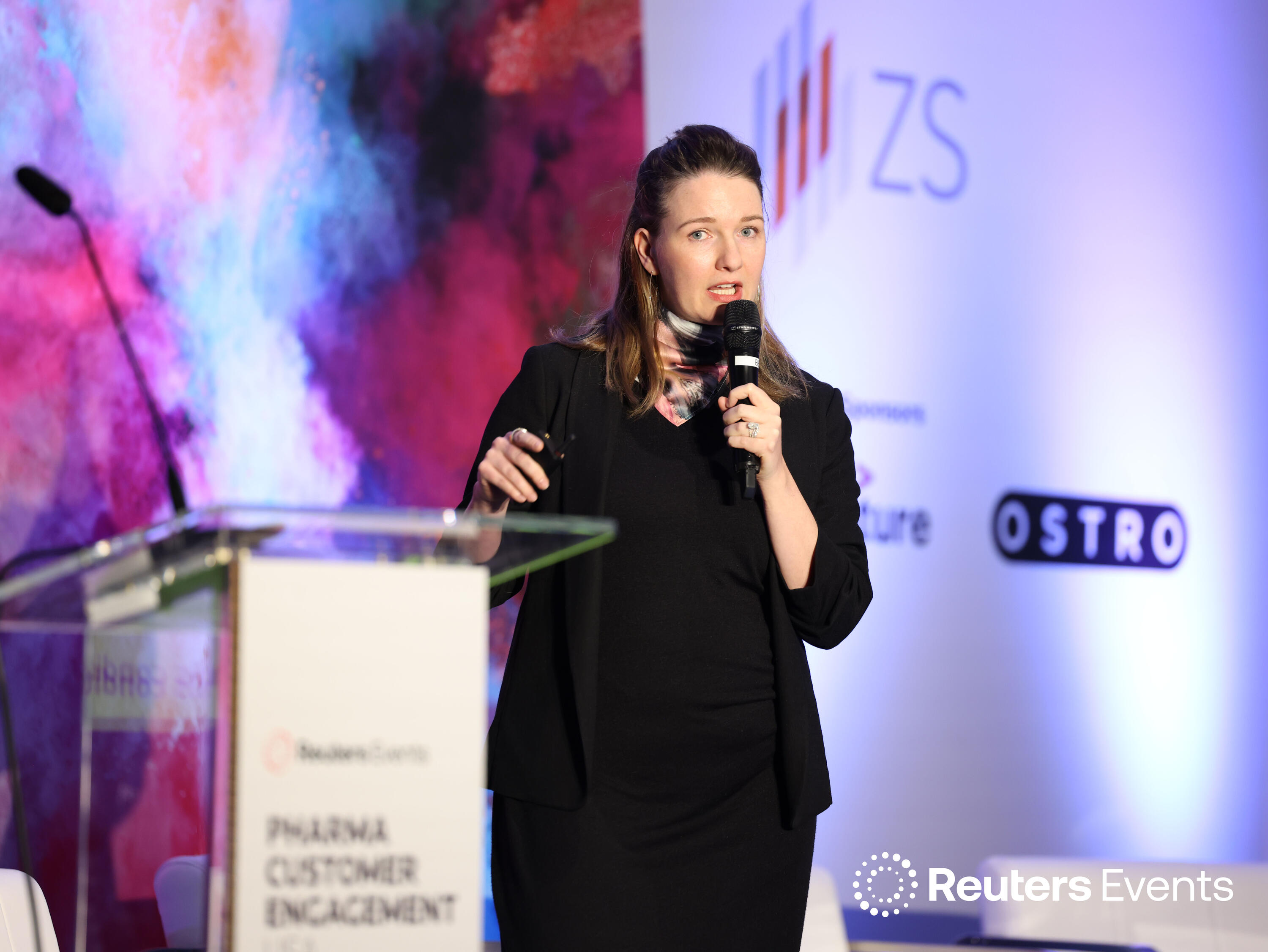 Speaker onstage at Pharma Customer Engagement Europe